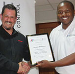 Mike Banda (right) thanks Kenneth McPherson after the presentation.